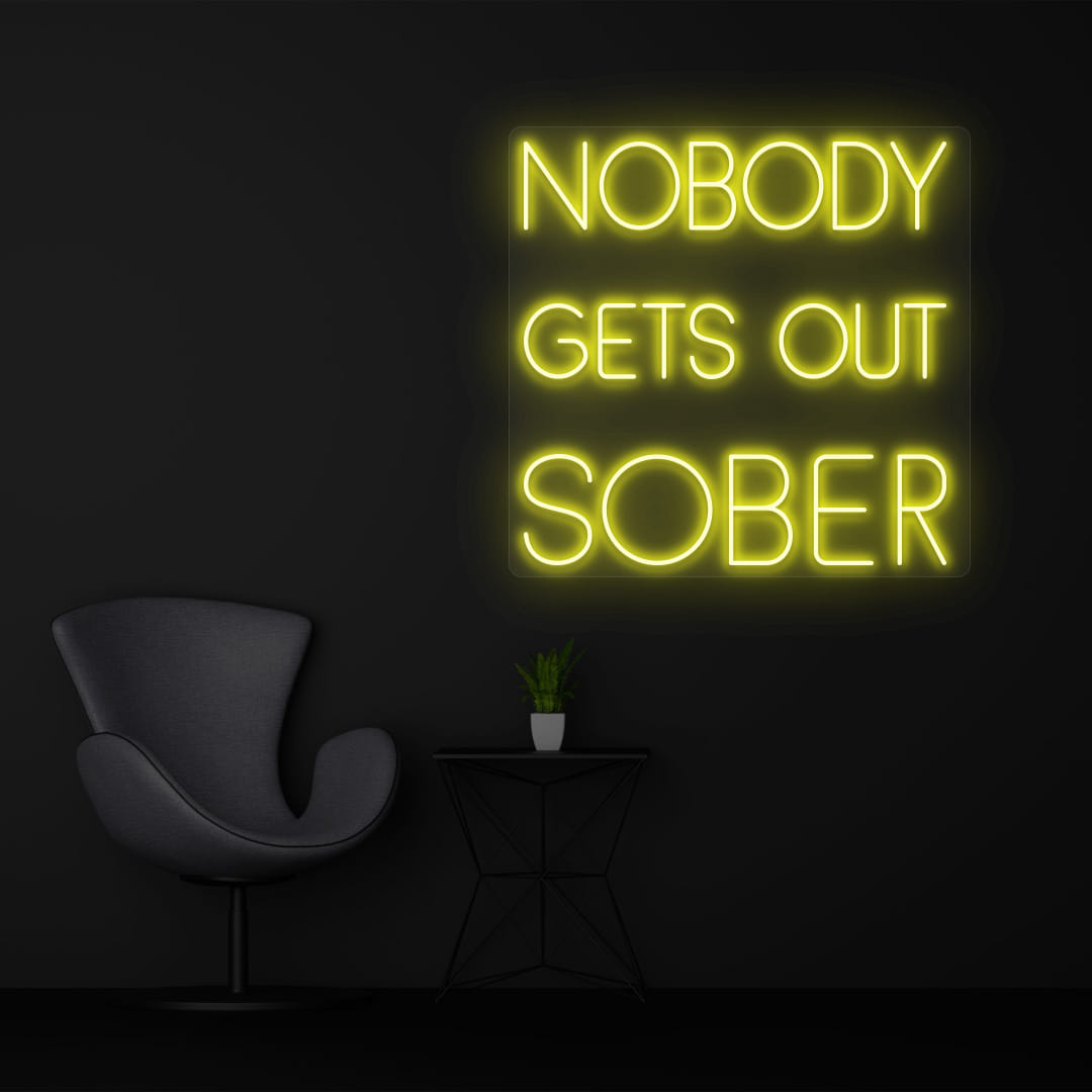 NOBODY GETS OUT SOBER yellow color